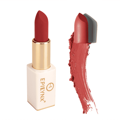 Coral-red lipstick with gold bullet, white case, and red swatch