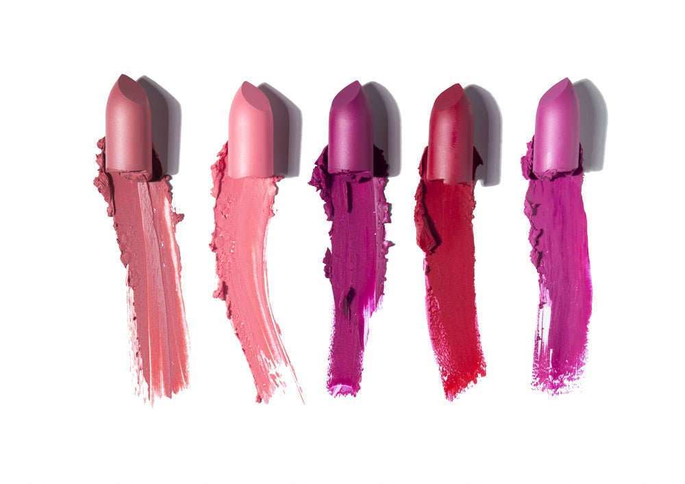 Assorted matte lipsticks with swatches in mauve, pink, red, and purple shades