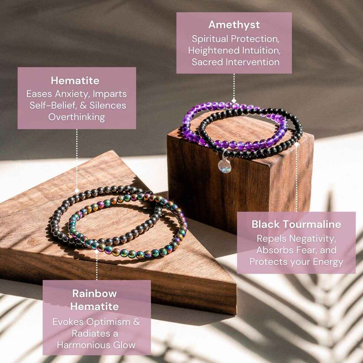Beaded wrap bracelets with purple and black beads and round silver charm on wooden blocks