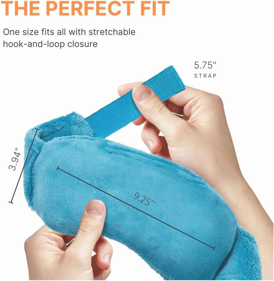 Blue plush warming eye mask held in hands with adjustable hook-and-loop strap