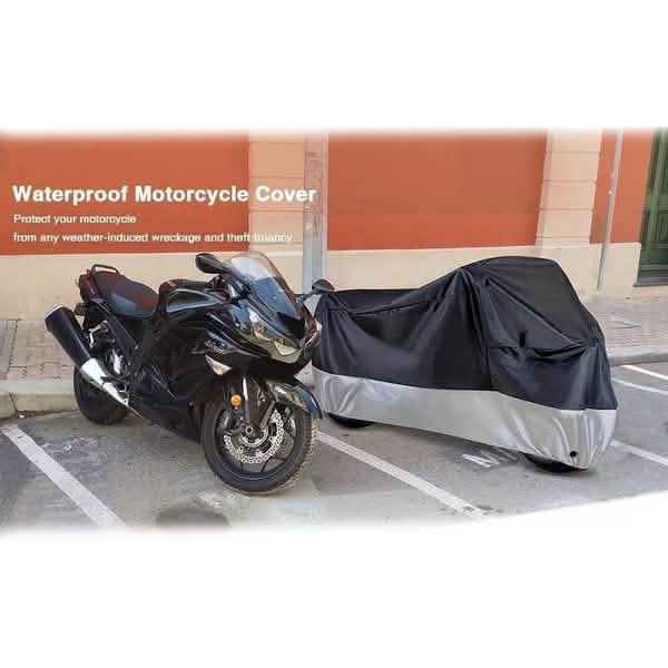 Motorcycle and bicycle cover over a parked motorcycle, black with grey lower half