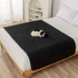 Waterproof pet bed cover, black quilted blanket with raised paw-dots texture