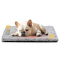 Grey plush pet mattress with tan-and-white bulldog resting on top