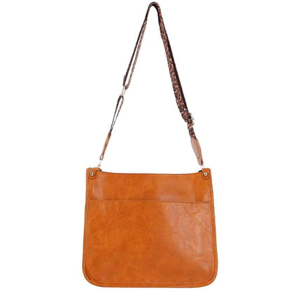 Orange leather crossbody bag with front zipper pocket and adjustable shoulder straps