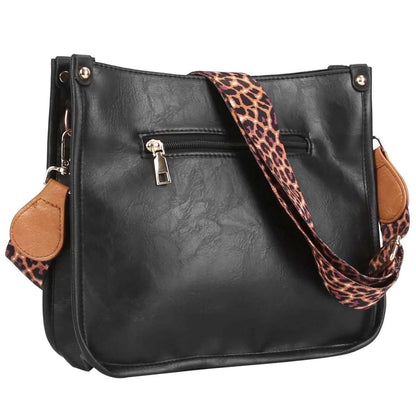Black leather crossbody bag with leopard-print strap and center zip pocket