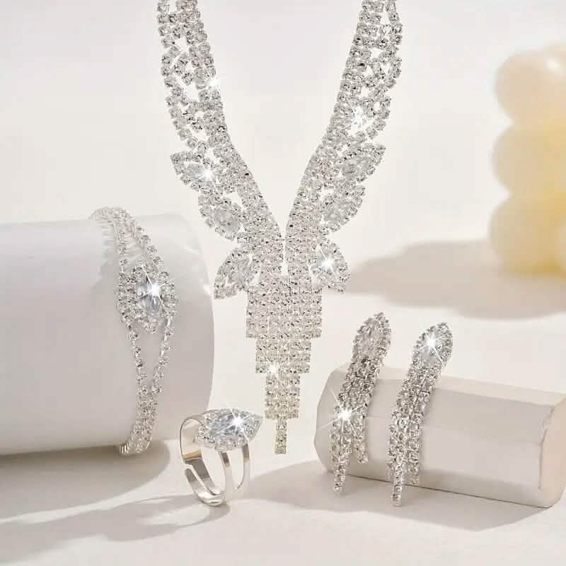 Rhinestone V-neck necklace with hoop earrings and matching ring