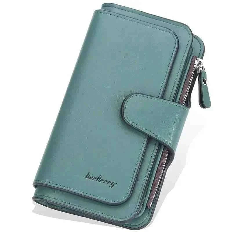 Green faux leather wallet with fold-over tab, card slots, and zipper pocket