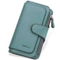 Green faux leather wallet with fold-over tab, card slots, and zipper pocket