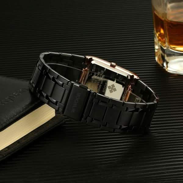 Square black wristwatch with gold trim, black metal bracelet, visible date window